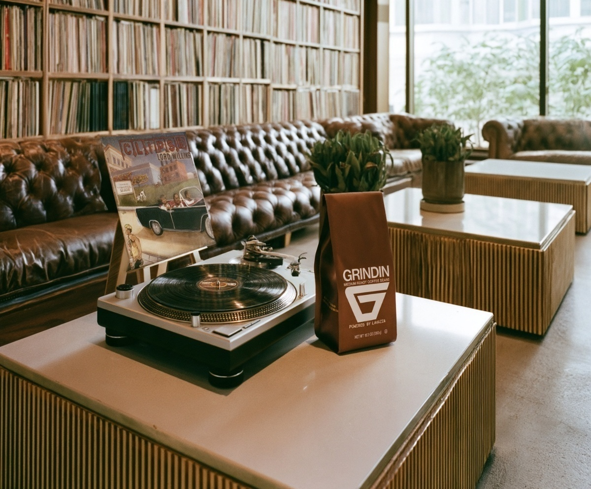 The Grindin Bundle — Grindin Medium Roast coffee beside the Clipse Lord Willin' record on a turntable